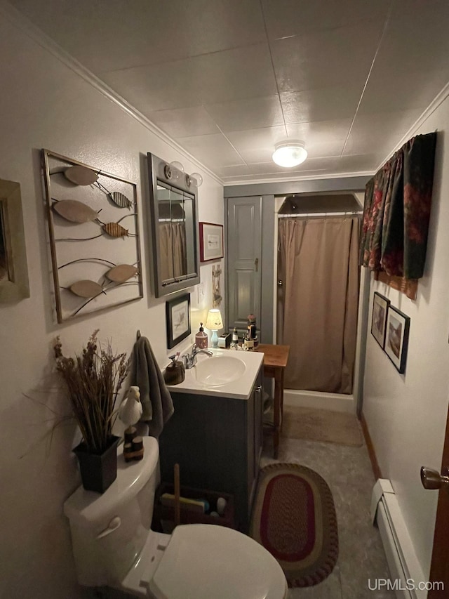 bathroom featuring vanity, crown molding, a shower with shower curtain, a baseboard radiator, and toilet