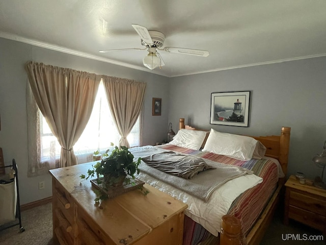 bedroom featuring carpet flooring, ornamental molding, and ceiling fan