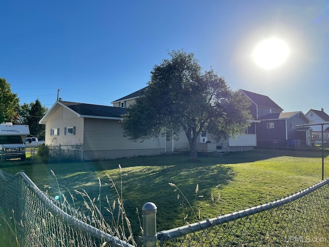 view of side of home featuring a yard