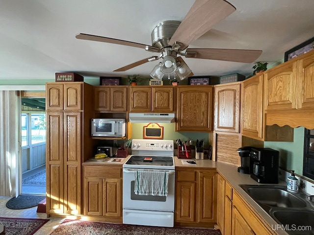 kitchen with sink, ceiling fan, and white range with electric stovetop