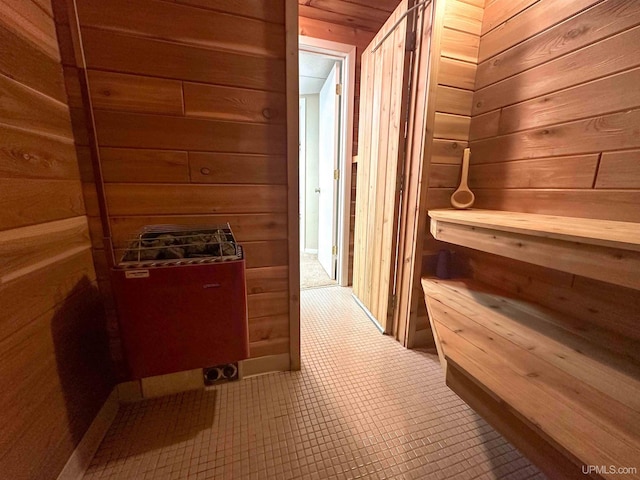 view of sauna with wooden walls