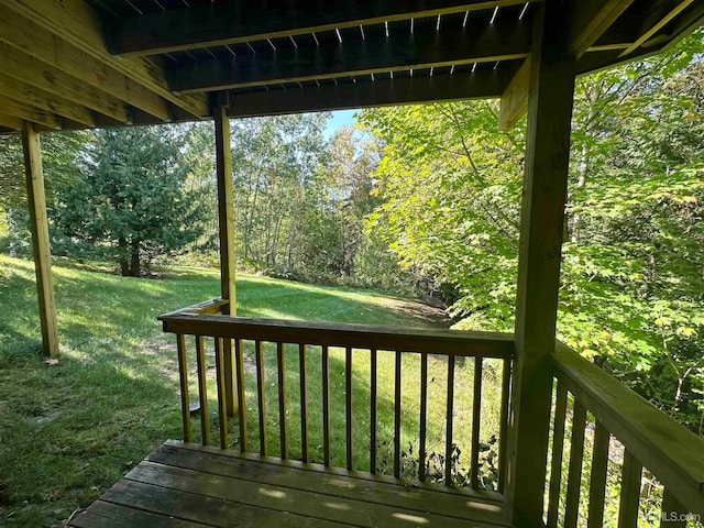 wooden terrace with a yard