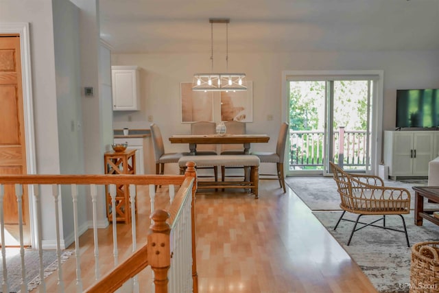 dining space with light hardwood / wood-style floors