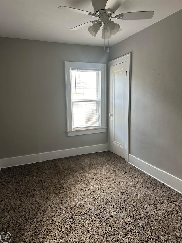 empty room featuring carpet and ceiling fan