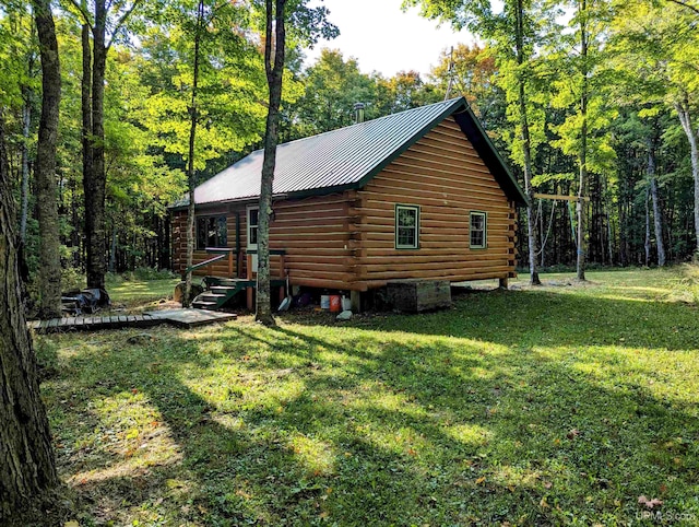 view of property exterior with a yard