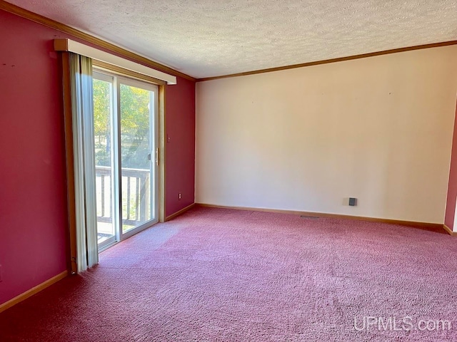 empty room with carpet floors, a textured ceiling, and crown molding