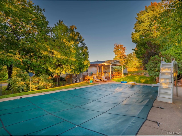 view of swimming pool with a patio