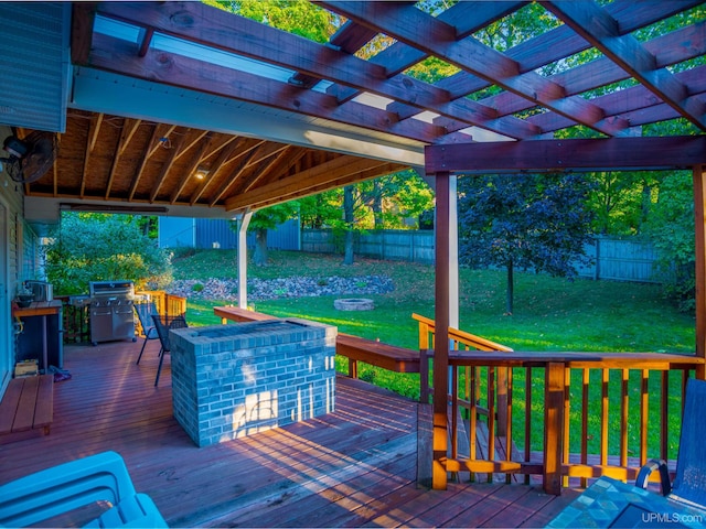 deck with a lawn, a pergola, a grill, and an outdoor fire pit