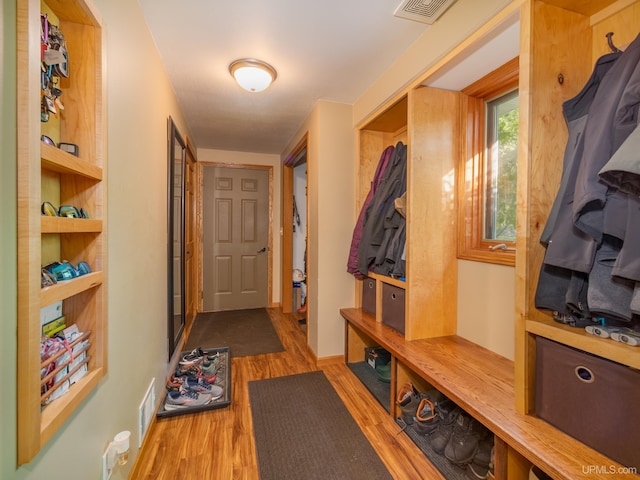 mudroom with light hardwood / wood-style floors