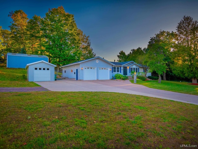 single story home with a lawn and a garage