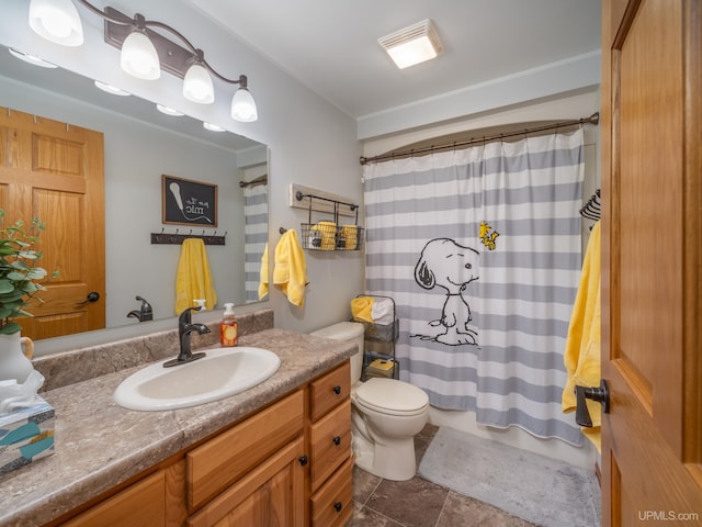 bathroom featuring a shower with shower curtain, tile patterned flooring, vanity, and toilet