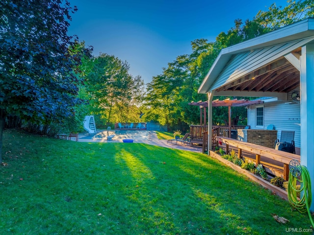 view of yard featuring a pool side deck