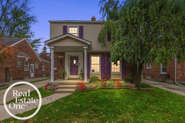 view of front of property with a front lawn