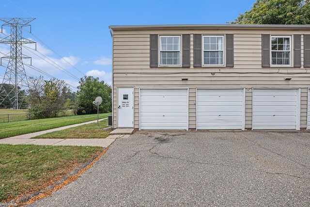 garage with aphalt driveway