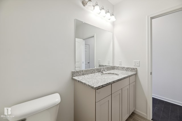 bathroom with vanity and toilet