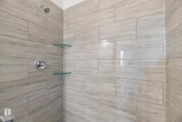 bathroom with tiled shower