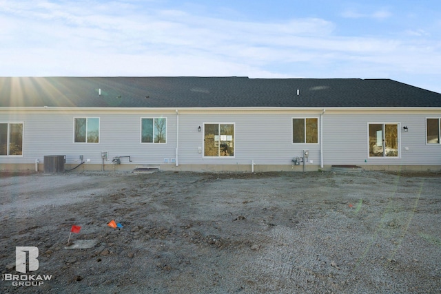 rear view of property with central air condition unit