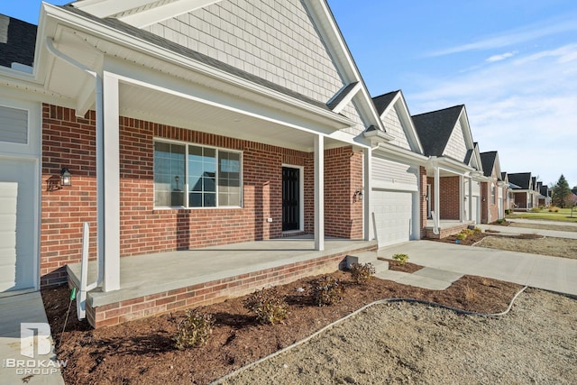 exterior space with a garage and a porch