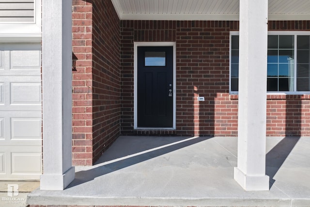 doorway to property featuring a porch