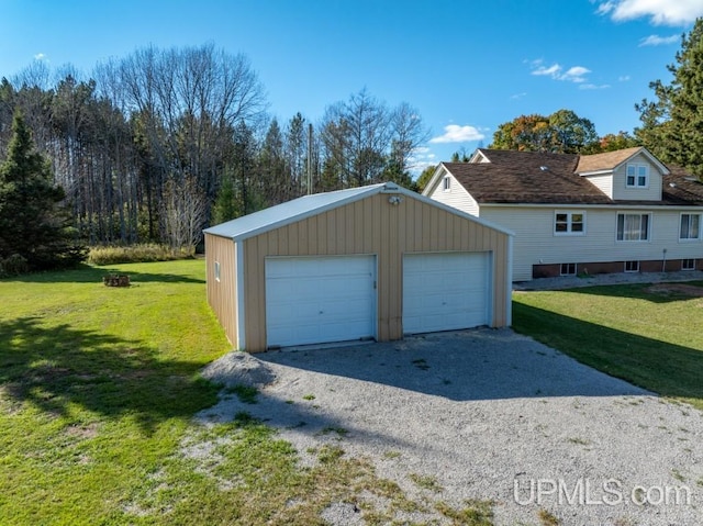 garage featuring a lawn