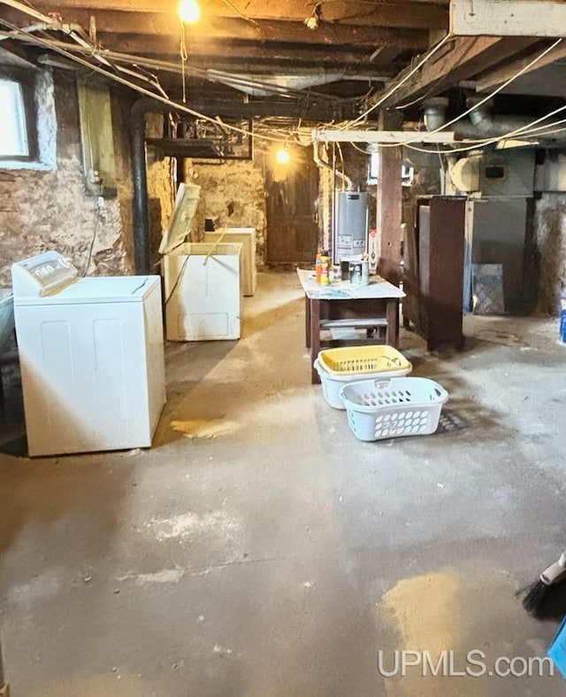 basement featuring washer / clothes dryer and gas water heater