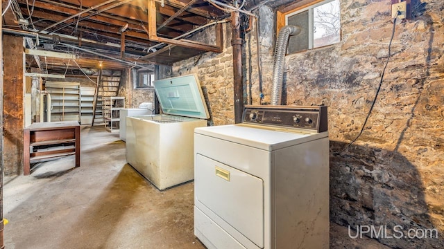 basement featuring washing machine and dryer