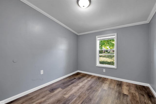 unfurnished room featuring ornamental molding and dark hardwood / wood-style floors