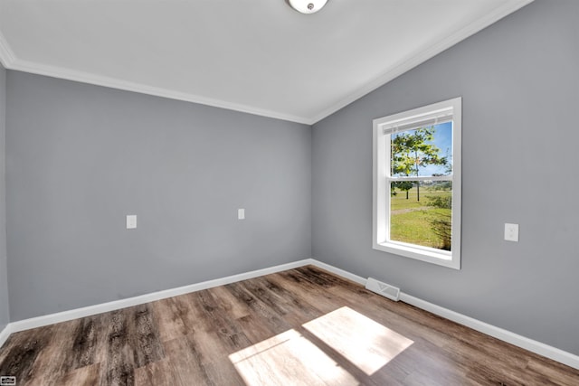 unfurnished room with hardwood / wood-style flooring, lofted ceiling, and crown molding