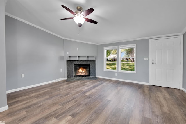 unfurnished living room featuring ceiling fan, hardwood / wood-style flooring, and crown molding