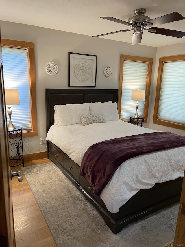 bedroom featuring light wood-type flooring and ceiling fan