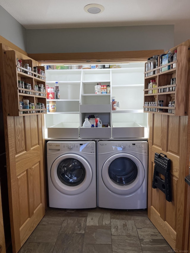 washroom featuring washing machine and dryer