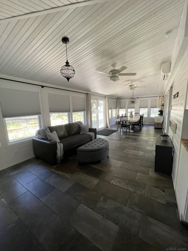 sunroom featuring ceiling fan, wood ceiling, and a wall mounted AC