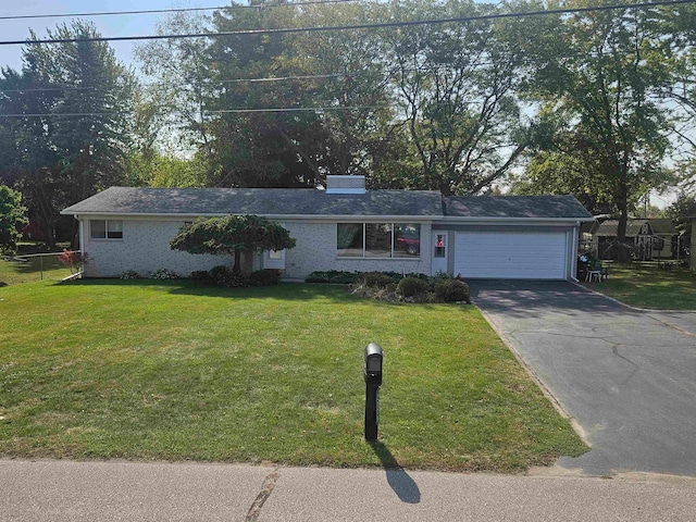 ranch-style house with a front yard and a garage