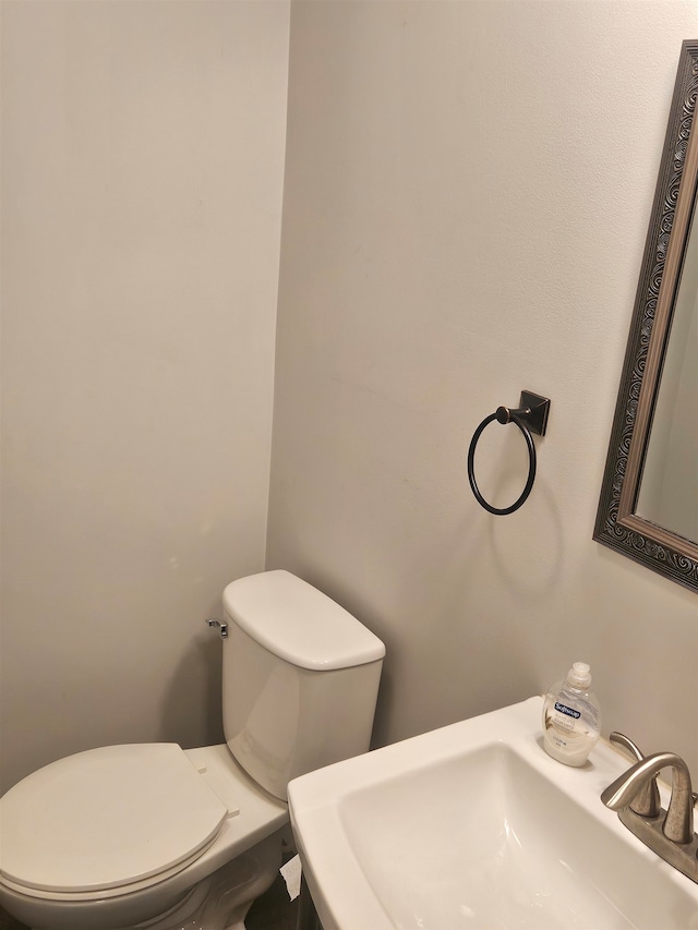 bathroom with sink and toilet