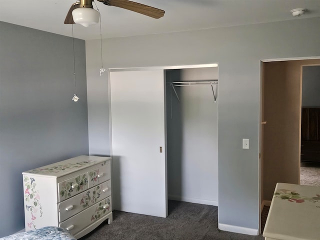 carpeted bedroom with a closet and ceiling fan