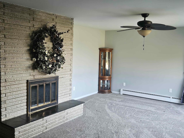 unfurnished living room featuring carpet, baseboard heating, ceiling fan, and a brick fireplace