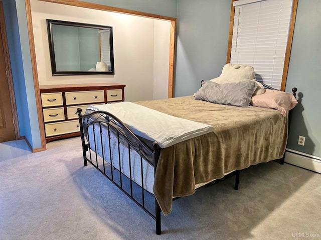 bedroom featuring light colored carpet