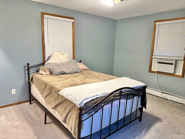 bedroom featuring a textured ceiling, cooling unit, carpet flooring, and a baseboard radiator