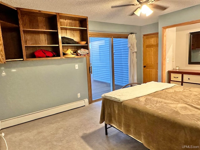 bedroom featuring a textured ceiling, baseboard heating, ceiling fan, and light colored carpet