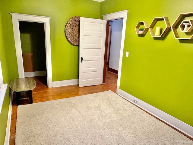 empty room featuring hardwood / wood-style flooring