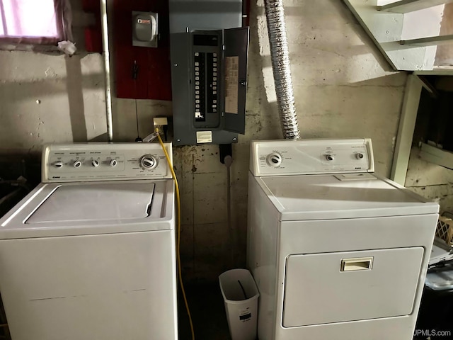 laundry room featuring electric panel and washer and dryer