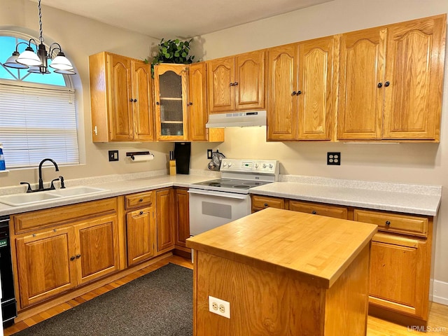 kitchen with a kitchen island, white electric range oven, pendant lighting, sink, and a notable chandelier