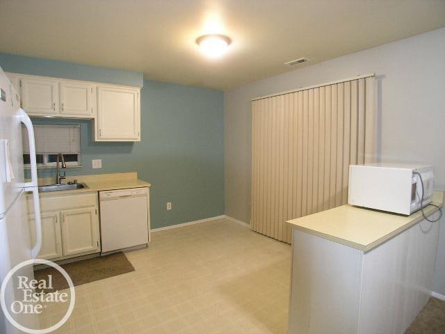 kitchen with white appliances and sink