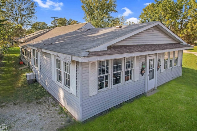 view of outbuilding with a yard