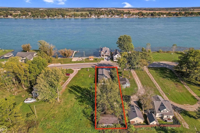 birds eye view of property featuring a water view