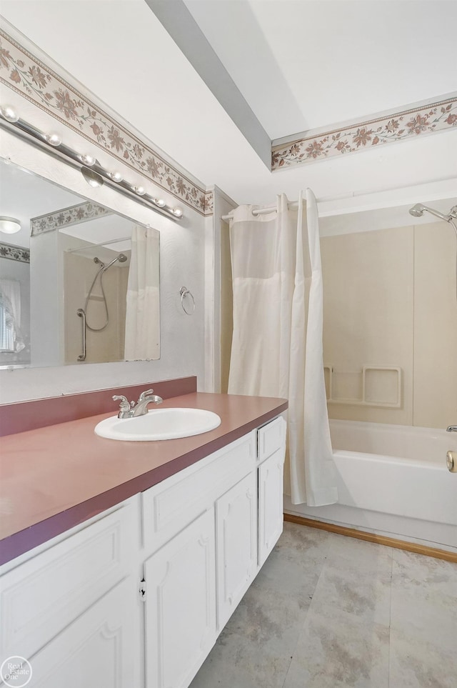 bathroom featuring vanity and shower / bathtub combination with curtain