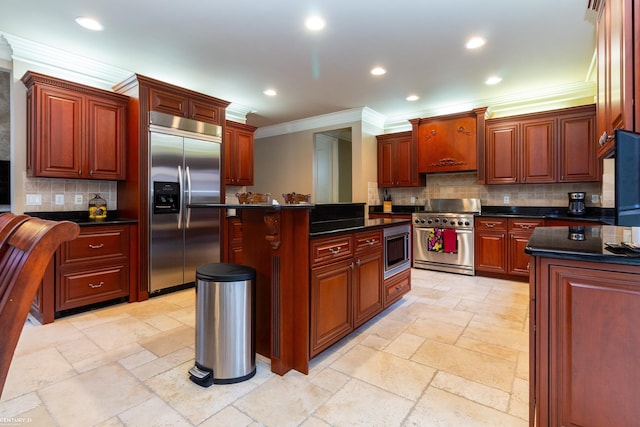 kitchen featuring built in appliances, ornamental molding, tasteful backsplash, and a kitchen island