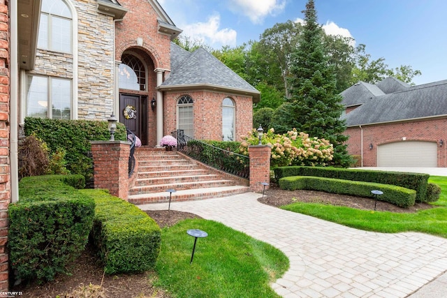 view of exterior entry with a garage