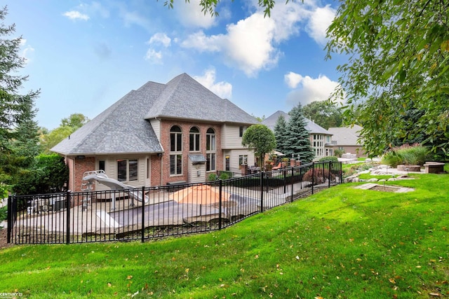 back of house with a yard and a patio area