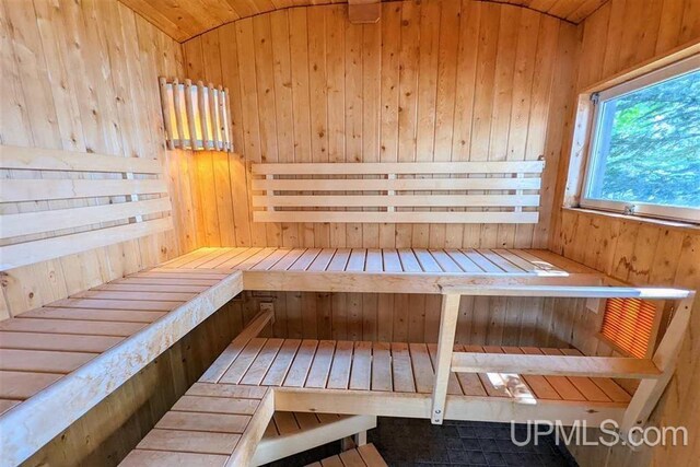 view of sauna / steam room with wooden walls